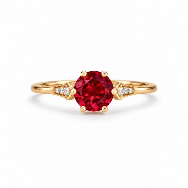 An oval ruby with three small diamonds on each side.