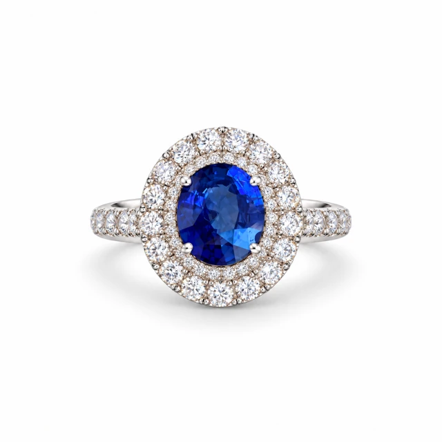 An oval blue sapphire with two rows of small diamonds around it.
