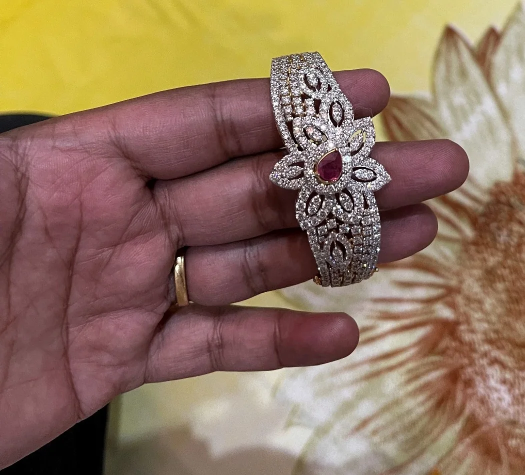 Murali’s commissioned diamond bracelet with its ruby centrepiece, held in a hand